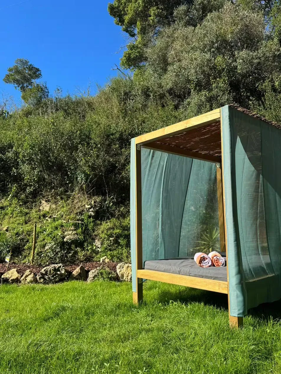 Outdoor canopy daybed — an open-air bedroom in the garden